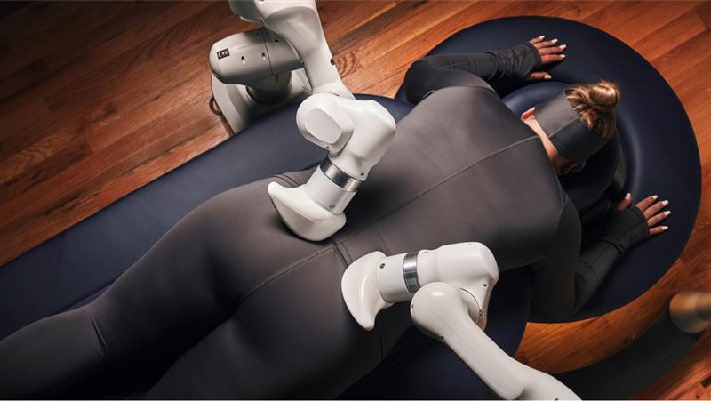 Person lying face down on an Aescape massage table