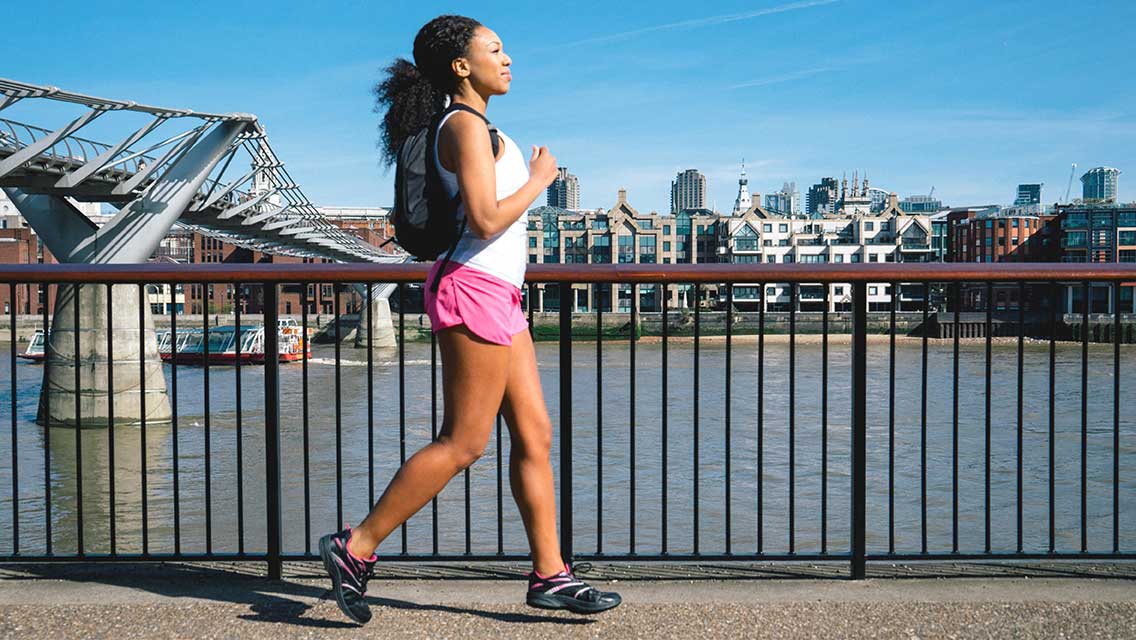 a woman rucking through an urban setting