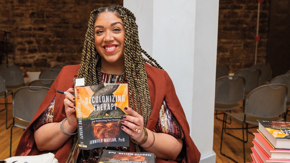 the author holding her book