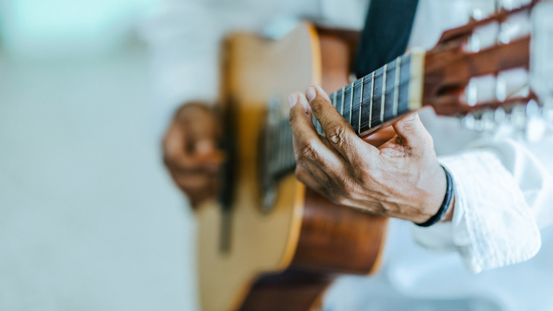 a person playing the guitar