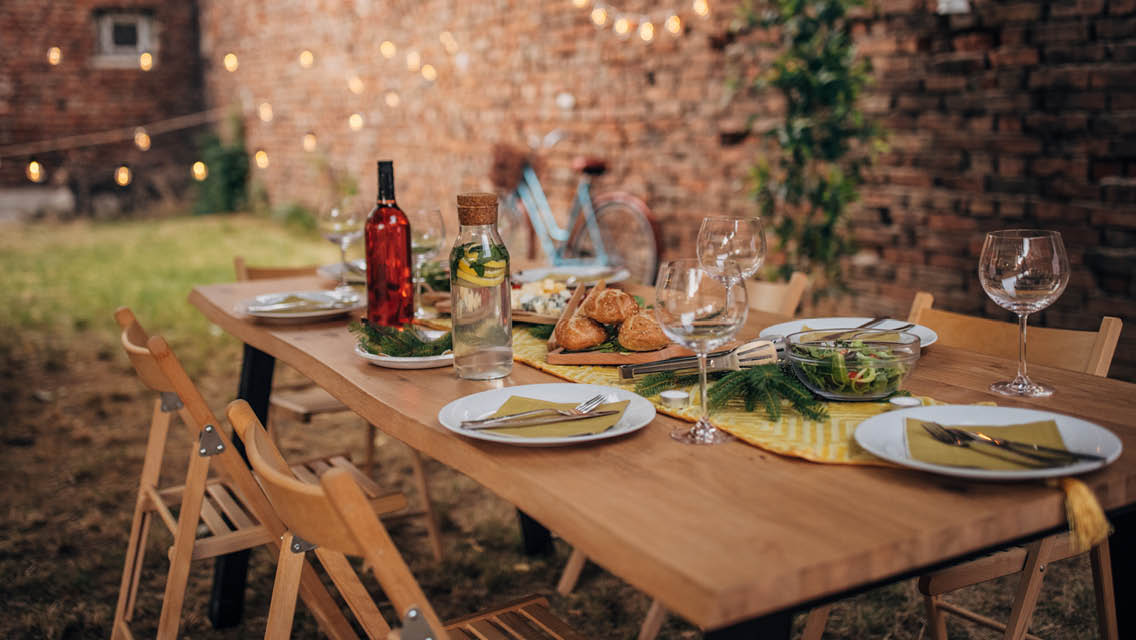 a festive table in a courtyard