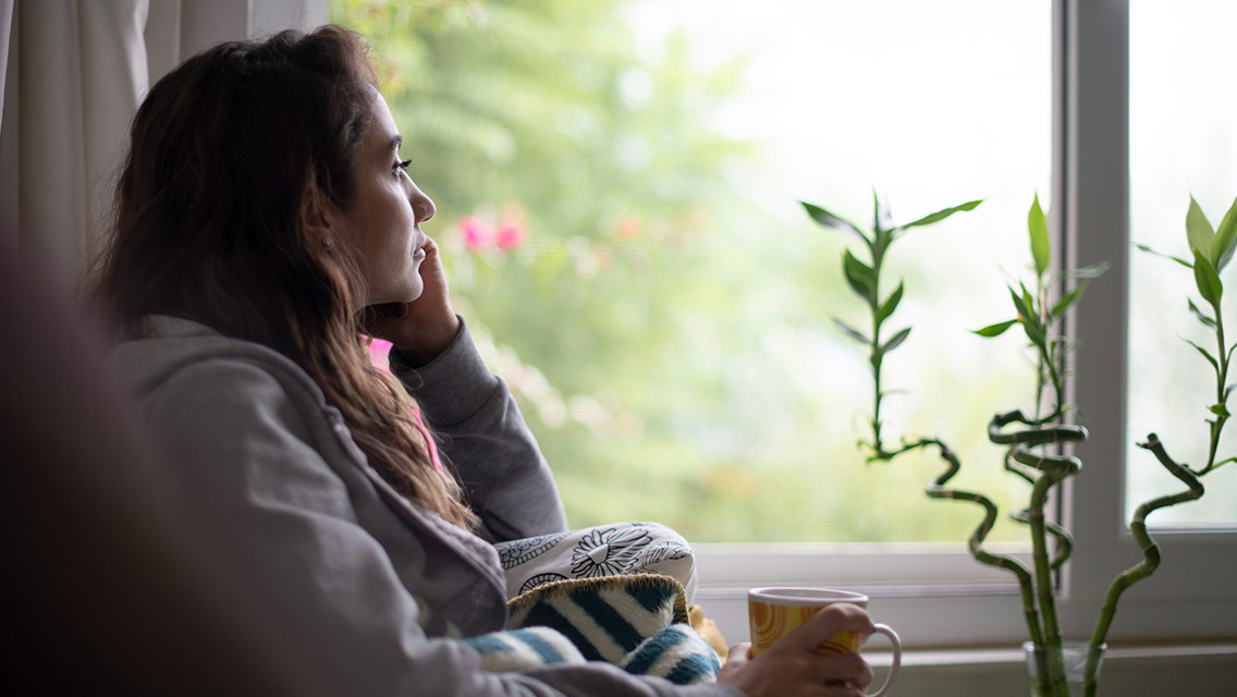 Woman sitting looking out the window