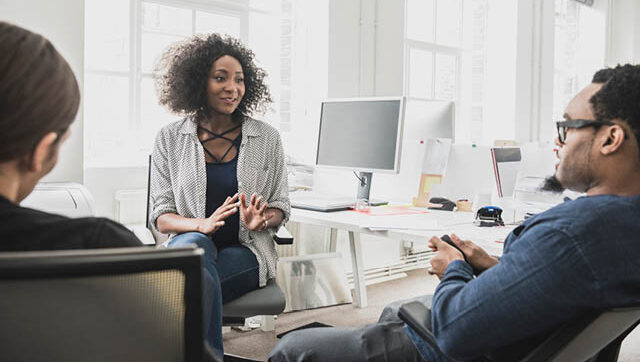 office space with person talking and leading group
