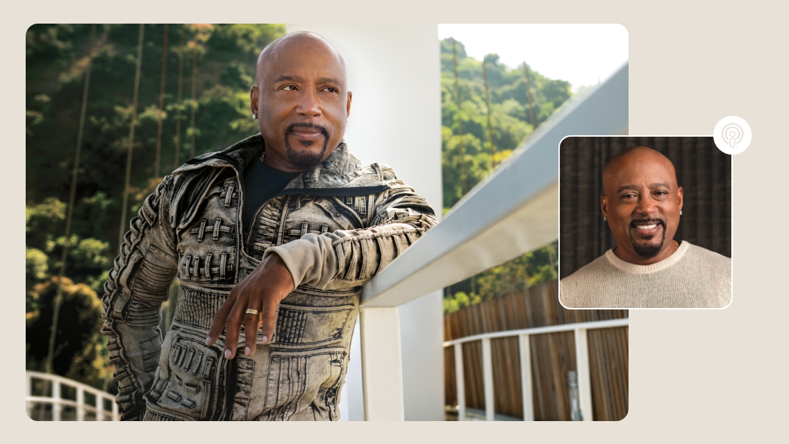 Daymond John leaning against railing