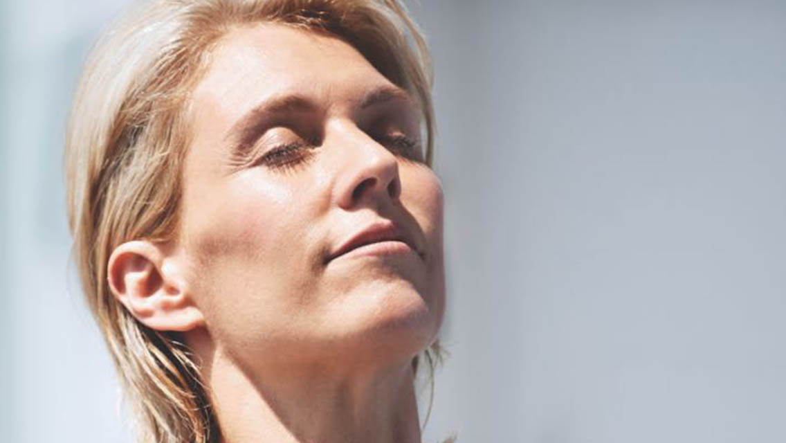 Woman breathing looking peaceful.