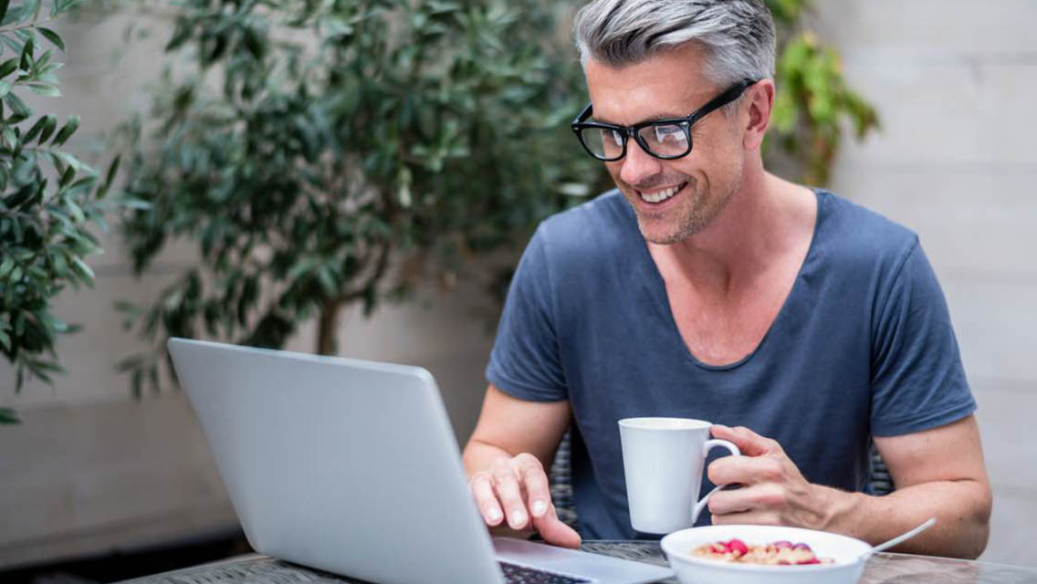Man working from home on a laptop.