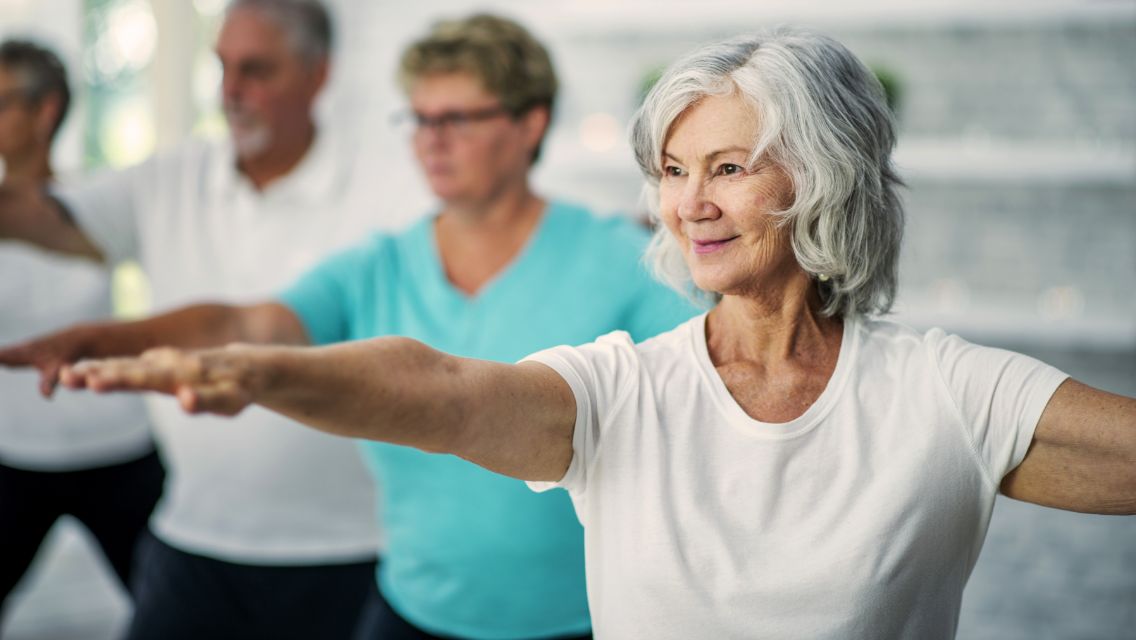 Four people in a tai chi class
