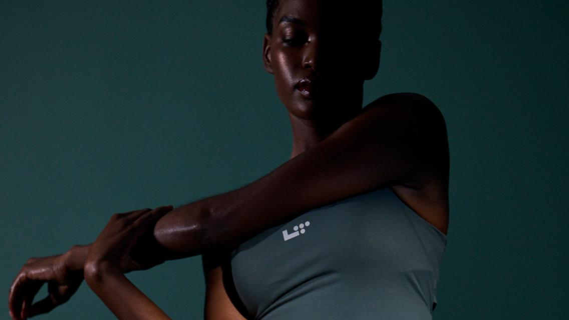 woman wearing green athletic clothes