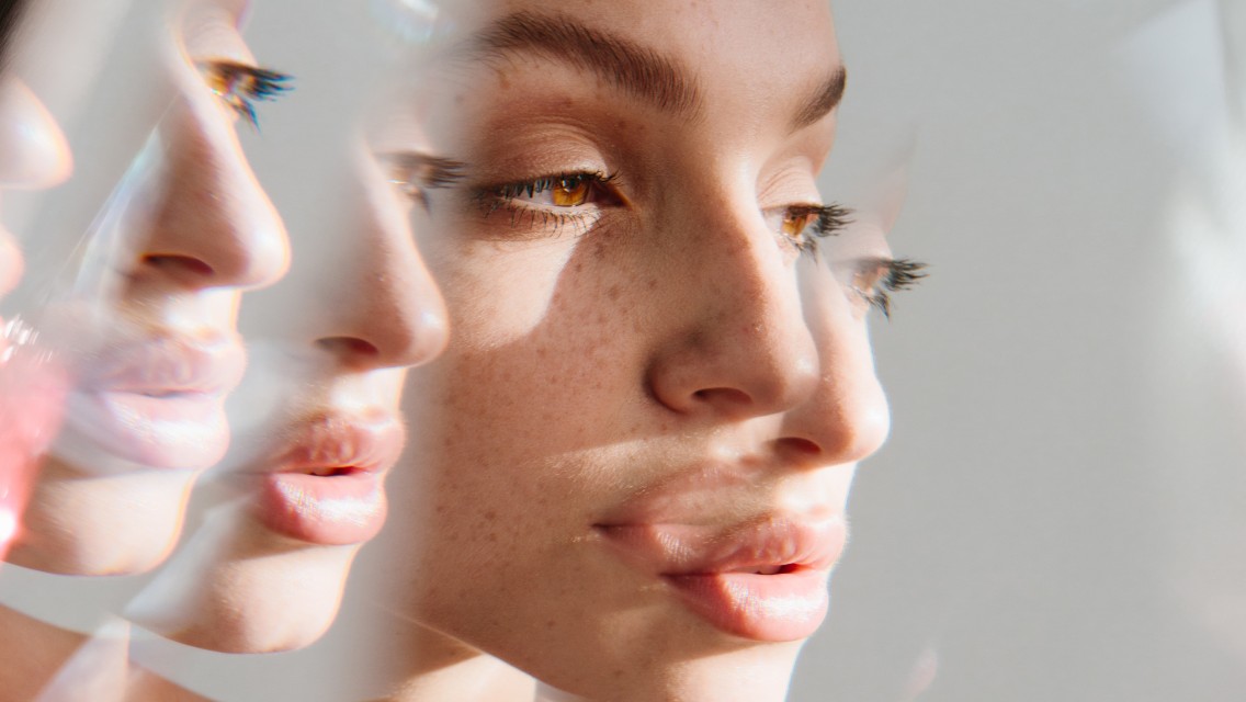 A woman looking a little brain-foggy with a kaleidoscope of her faces.