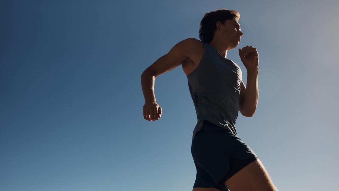 Person running outdoors in sunny weather