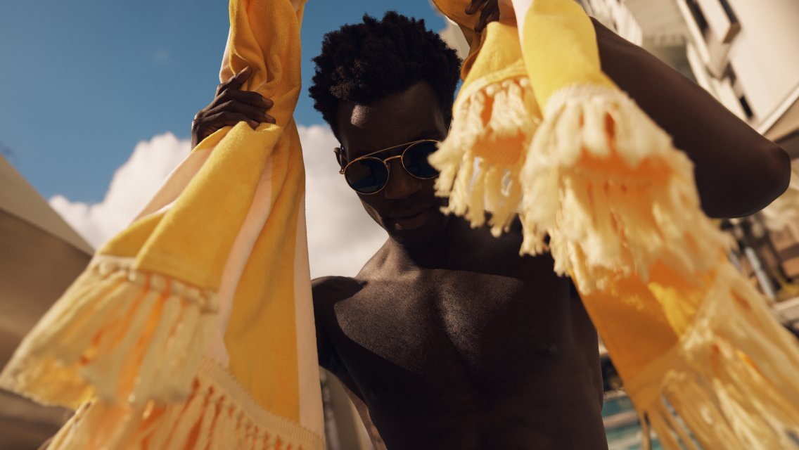 Person holding a beach towel
