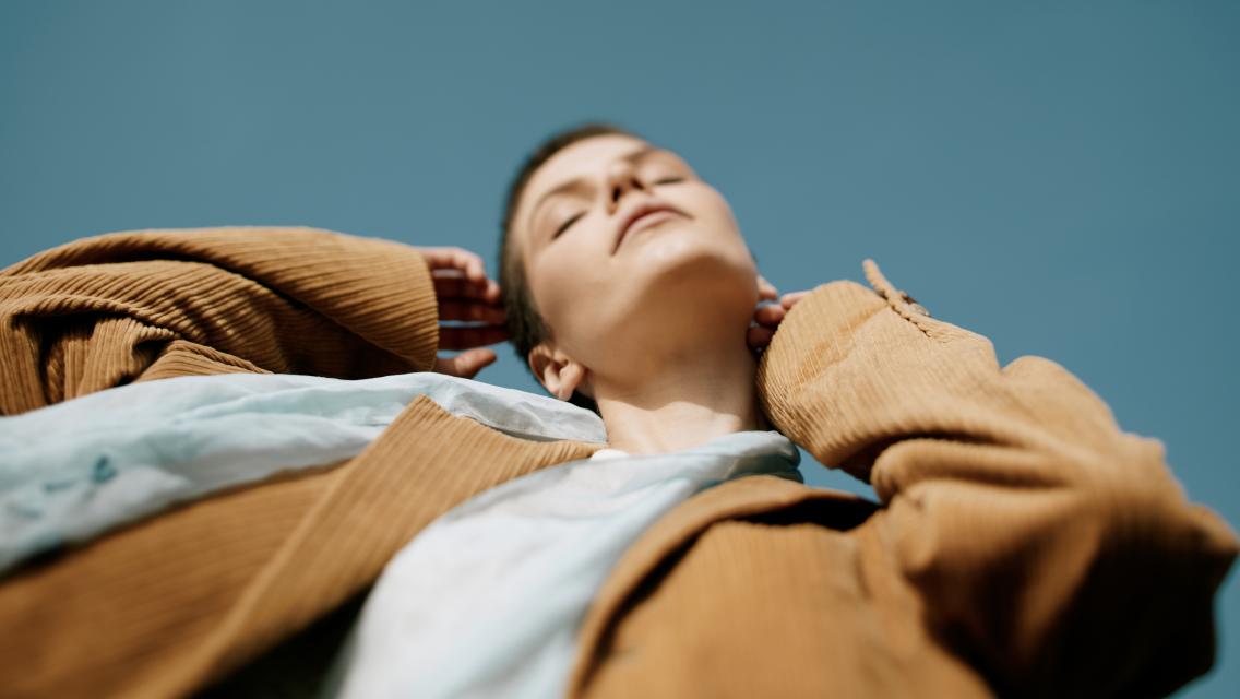 woman touching her head