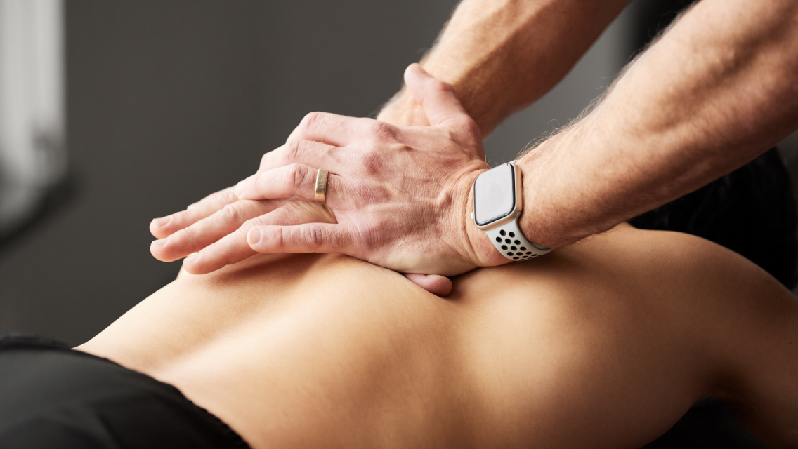 hands on back giving an adjustment