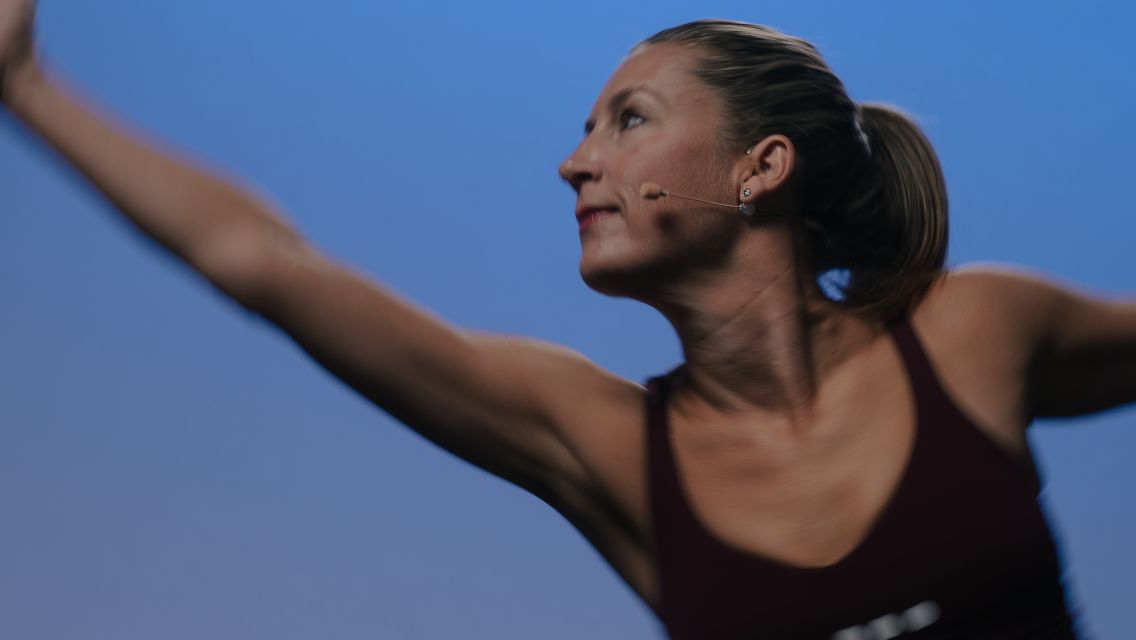 woman with arm stretched in front of her