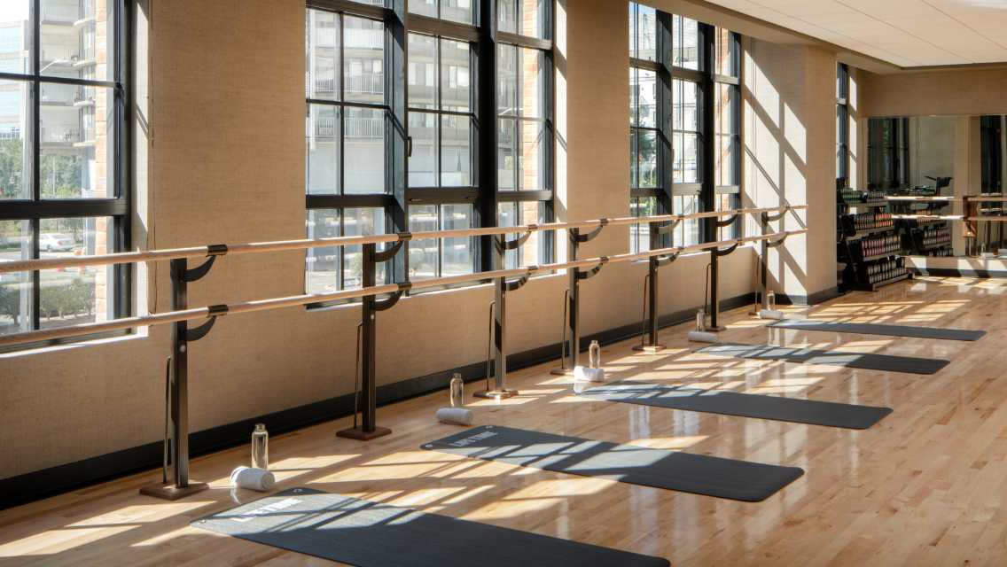 Barre studio with a row of exercise mats