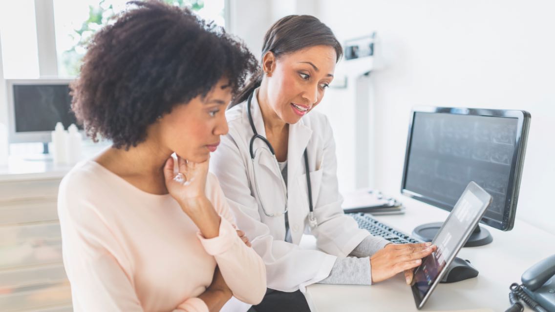 Doctor talking to a patient.