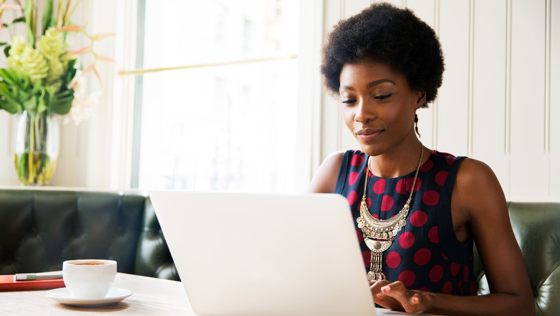 A woman working on a laptop.