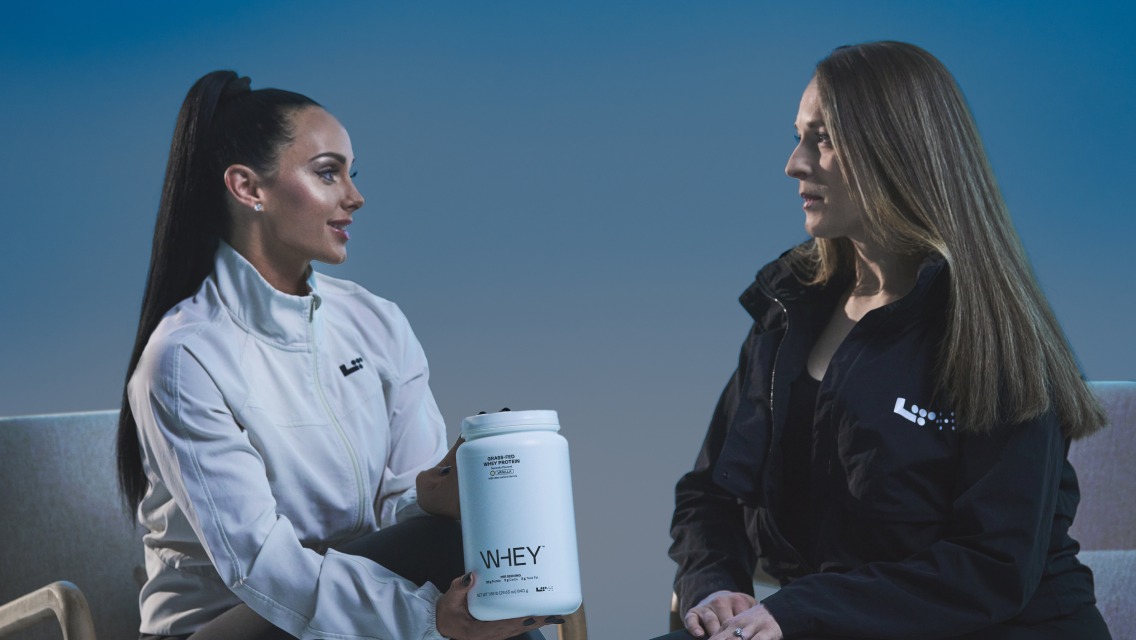 two trainers discussing whey protein