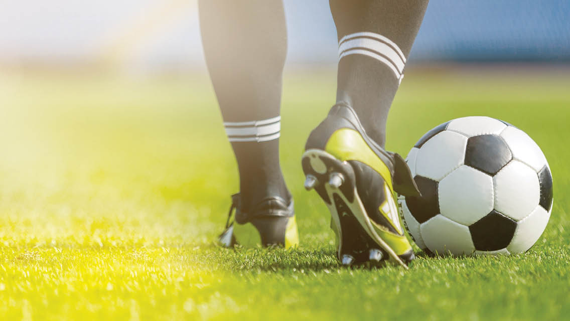 feet and a soccer ball