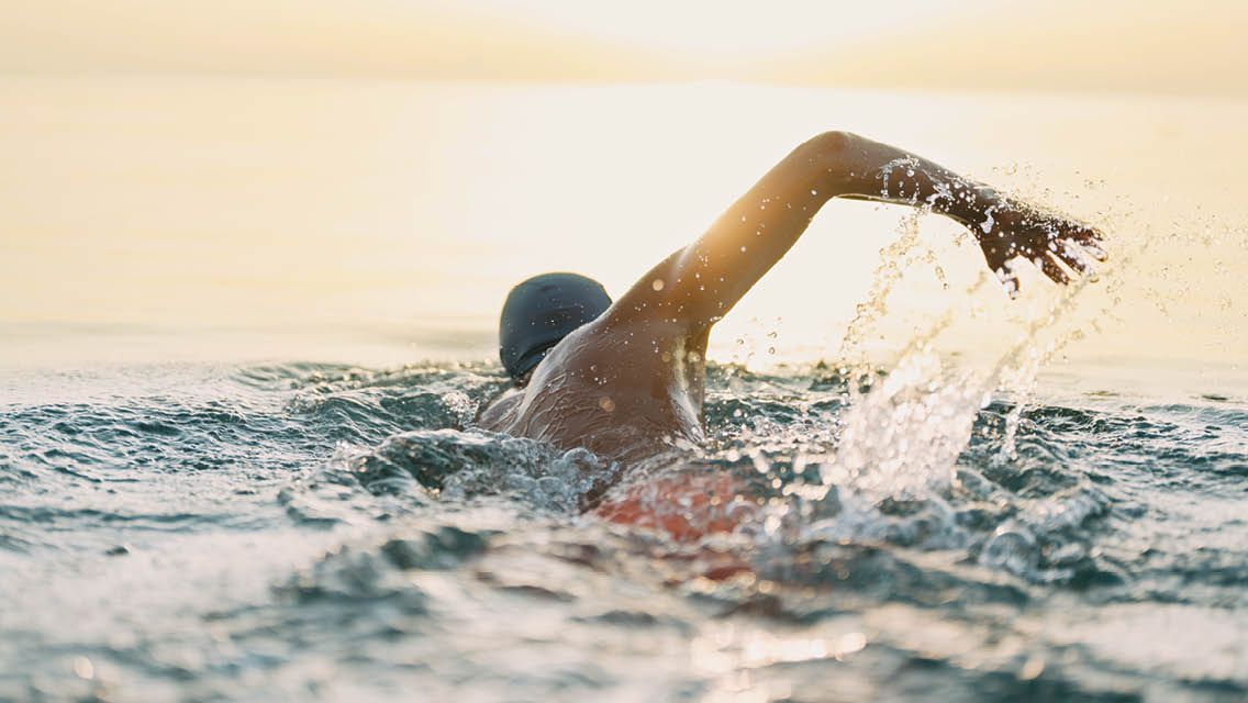 a person swimming in a lake