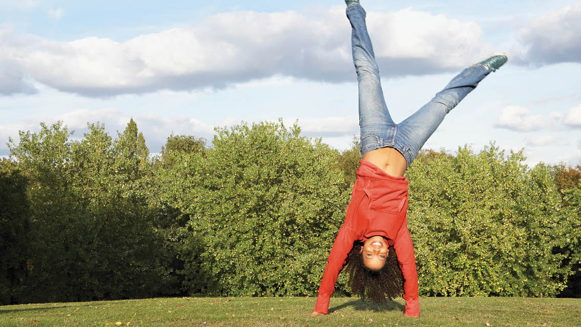 person performing a cartwheel