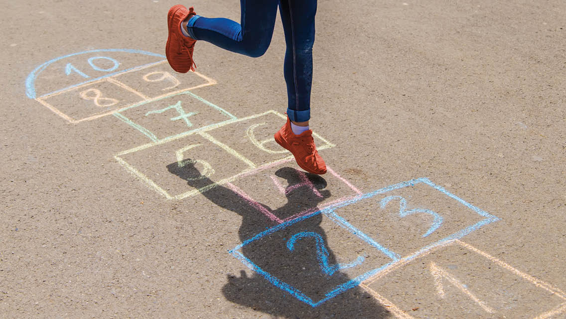 person playing hopscotch