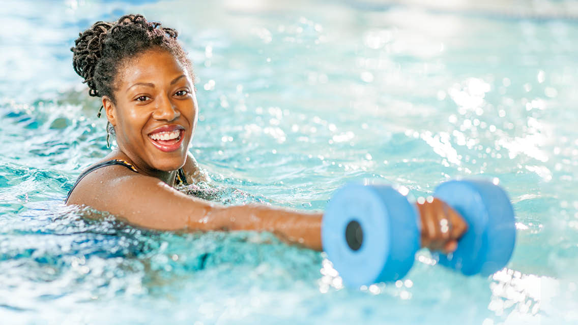 a woman performing water aerobics