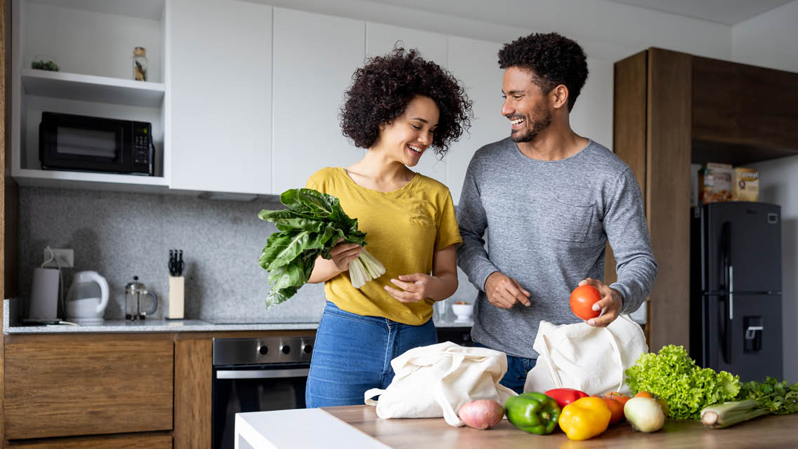 a couple unpacks healthy groceries