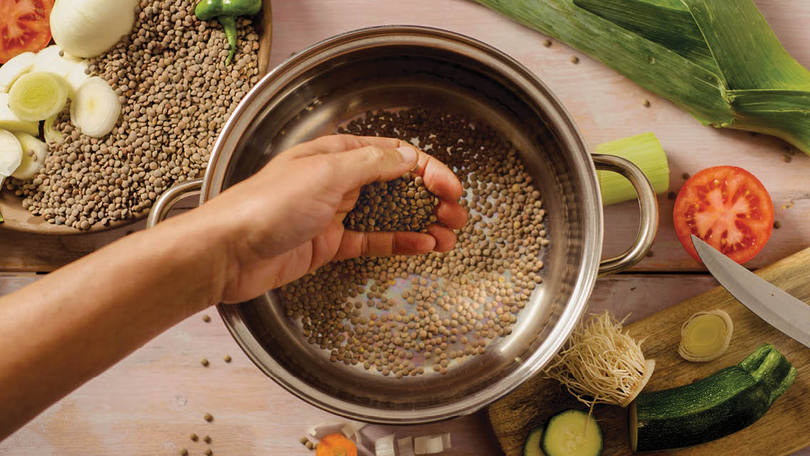 a person cooking quinoa