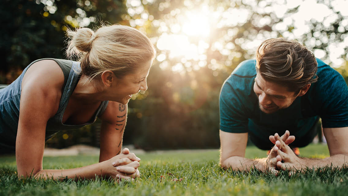 people hold plank whilst chatting away