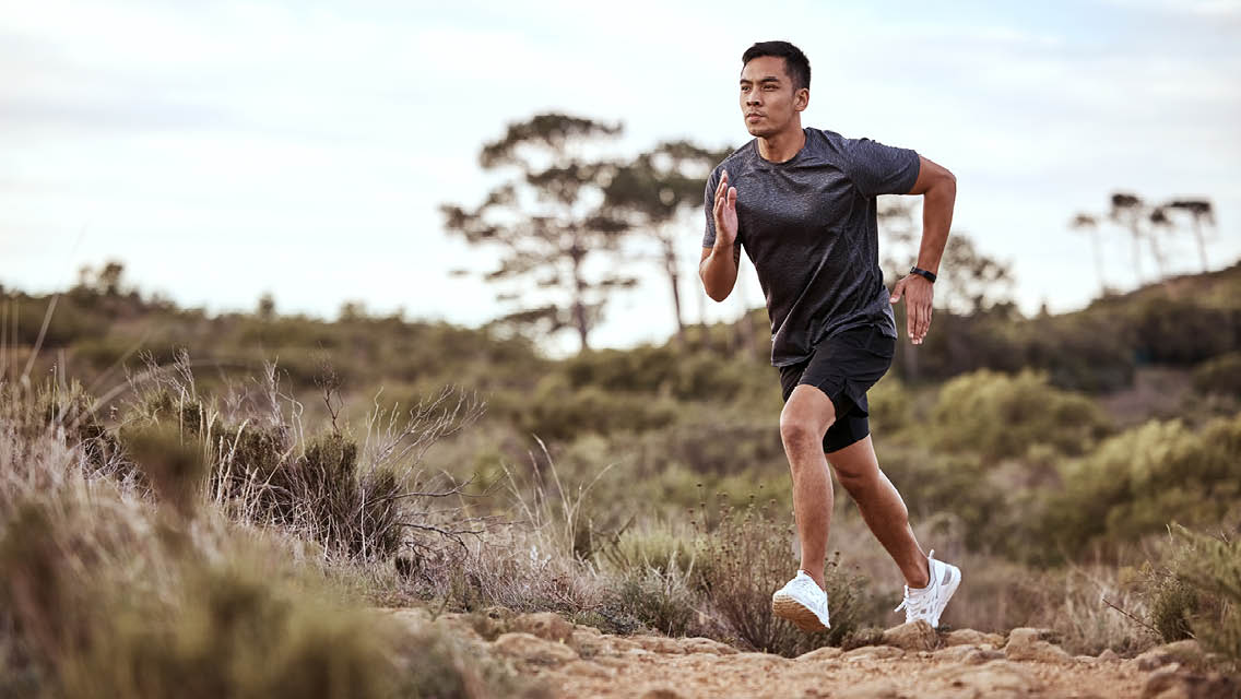 a man runs in a desert setting