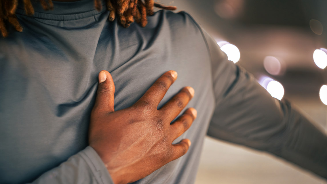 a man places his hand on his heart