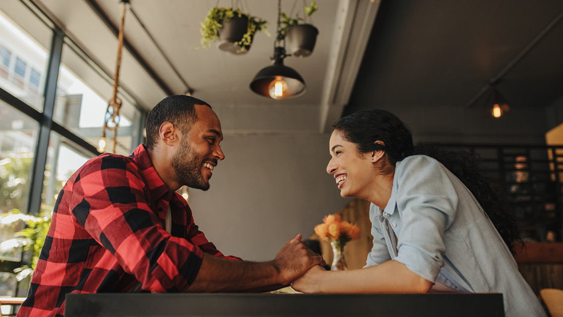 two people talk in a restaurant