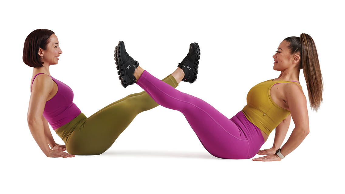 two people hold a v sit while working out