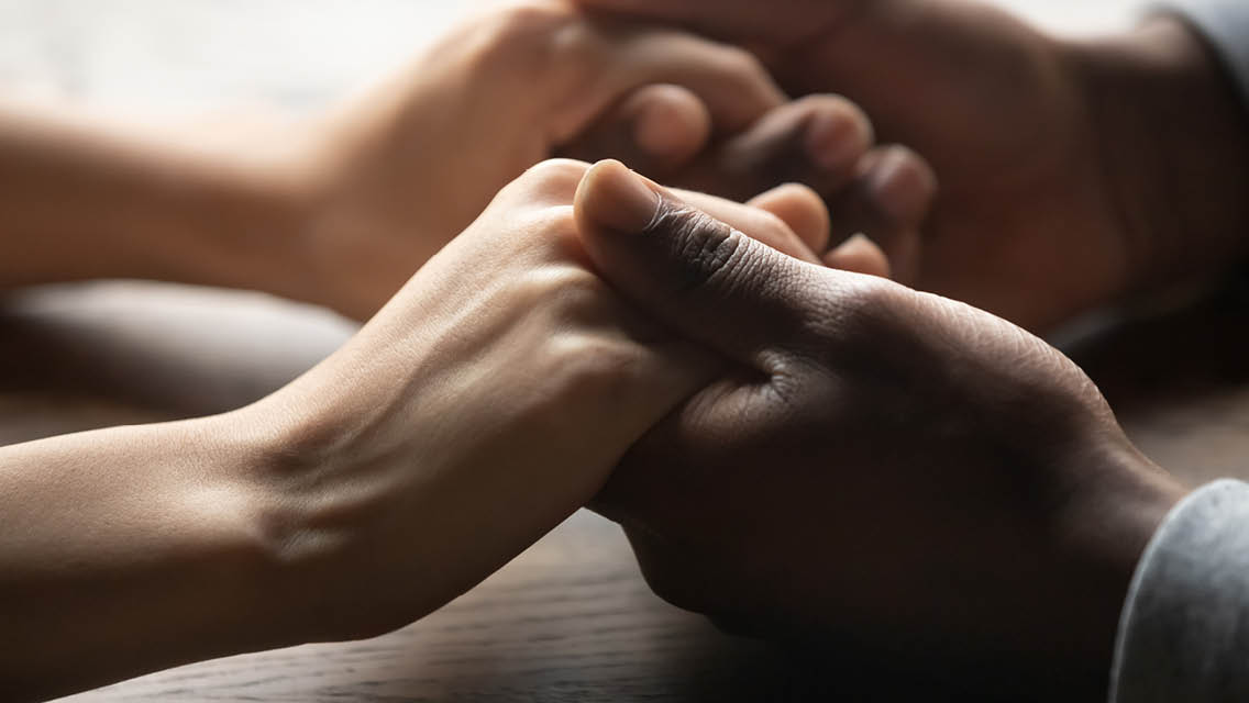 a couple holds hands